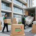 Professional apartment movers in Dubai carrying packed boxes and furniture during a residential move